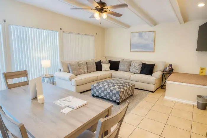 Spacious Coastal Retreat | Dining + Lounge | Near Beach
Relax in this bright, open-concept living & dining space with a comfy sectional, stylish décor and natural light. Enjoy meals at the wood dining table, unwind with smart TV & board games.