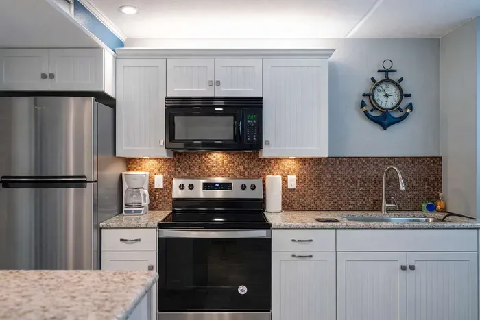 Modern Coastal Kitchen | Stainless Steel Appliances | Granite Counters | Nautical Decor | Bright & Clean | Perfect for Beach Getaways