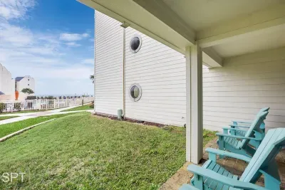 Covered Patio with Adirondack Seating — Relaxing Coastal Views & a Peaceful Spot to Enjoy the Breeze