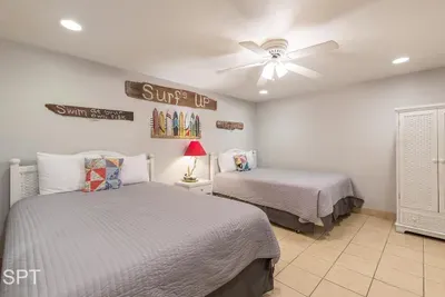 A soft, welcoming coastal room that feels instantly easy to settle into, with gentle colors and relaxed beach touches creating a calm, unhurried vibe. It’s the kind of space that invites slow mornings, simple comfort, and effortless downtime.
