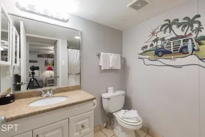 Vibrant Coastal Bathroom — Clean Finishes, Bright Vanity & a Fun Beach Mural Guests Will Love