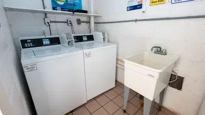 Steady, simple laundry space with an easygoing feel—kept clean, organized, and practical for guests settling in during longer stays. A straightforward setup that supports the rhythm of a beach trip without overselling features or amenities.