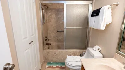 Calm, tidy bathroom space with a clean, welcoming feel—simple touches and soft tones create an easy, relaxed vibe that fits naturally into the flow of a beachside stay. A bright, uncluttered setting that feels genuine without leaning on amenities.