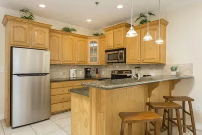 Modern Kitchen with Granite Counters, Stainless Appliances & Cozy Breakfast Bar — Bright, Functional & Perfect for Cooking and Gathering