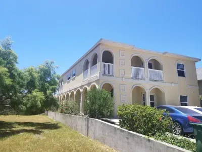 Exterior shot day. Down that left hand side if you walk down the covered patio is pool in back