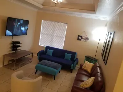 Living room has 50 inch flat screen and cable, wifi, DVD player for movies. The couch folds down into a sleeper the blue/aqua one. perfect for kids with 3rd bathroom off the living room