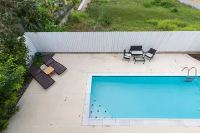 pool has walk in steps and loungers. Great for kids as 3 to 5 feet deep but big enough to swim laps