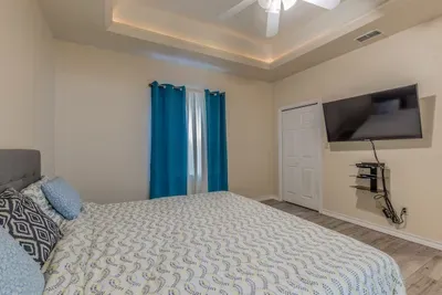 Flat screen in master bed. Has a walk in closet too and black out curtains