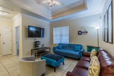 clear shot of living room. The Blue sofa folds down to a sleeper. There is also a DVD player for movies (red box is at CVS) and cable TV /wifi is included