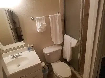 2nd bathroom off master bedroom full bath but walk in shower no tub. Great for limited mobility guests or handicap. Understand no handicap bars in shower however, FYI