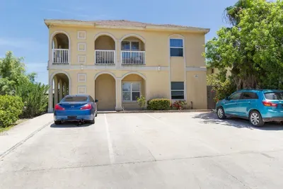 Outside of complex during day. Parking is 2 spots back to back rather than side by side. walk to beach 1 block + 40 yards away