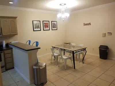 Kitchen table and bar area. Metal chairs, I state this as the white ones look like plastic but are not