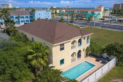 Bright 2BR Beachside Retreat w/ Sparkling Pool, Balconies, Lush Garden & Walk to Oceanfront Dining