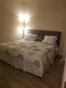 Shot of california king in master bedroom. Cool gel temper mattress as well