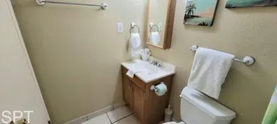 A bright, spotless bathroom offering a clean vanity, fresh towels, and a well‑kept shower space, giving guests a comfortable, refreshing place to get ready or unwind, with thoughtful essentials provided for a smooth, stress‑free stay.