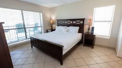 Calming Bedroom Retreat  
Unwind in this bright, inviting bedroom featuring a comfortable  bed, warm wood accents, soft natural light & soothing décor. A peaceful, well‑kept space designed for restful nights & relaxed mornings throughout your stay.