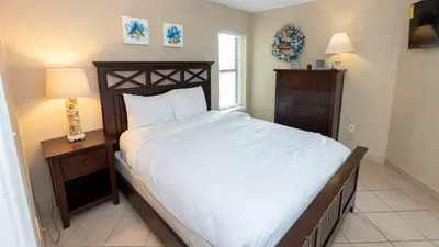 Relax in this bright, well‑kept bedroom featuring a cozy bed, warm wood furnishings, soft natural light and calming décor. Ideal for unwinding after a day of adventure, offering comfort, cleanliness, and a peaceful retreat.