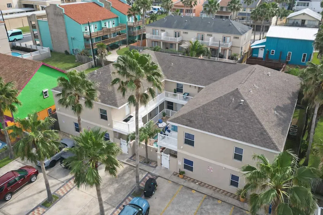 Vibrant Coastal Retreat with Pool, Palm Trees & Colorful Views – Walk to Beach, Sleeps 6+