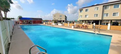 Relax by the sparkling outdoor pool, spacious seating, and sunny resort vibes. Perfect for unwinding, gathering with friends, or enjoying peaceful mornings in a bright, inviting community setting steps from your stay.