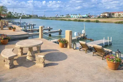 Waterfront Retreat with Private Dock, Boat Lift & Scenic Patio — Steps from Coastal Dining & Fun