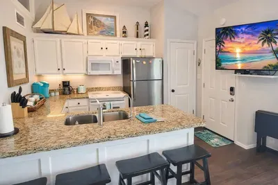 Bright Coastal Kitchen Retreat – Granite Counters, Stainless Appliances, Nautical Decor, Coffee Station, and Smart TV – Steps from Beach Fun & Relaxation