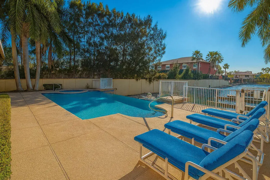 Tropical Poolside Oasis
Lounge on chaise chairs by the sparkling turquoise pool, framed by swaying palms and lush greenery. Sunny pavers lead to serene lagoon views—ideal for refreshing dips and ultimate relaxation in paradise!