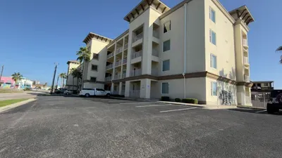 Modern Condo with Easy Parking
Contemporary multi-story condo building with balconies and palm-lined facade offers ample on-site parking just minutes from the beach. Arrive stress-free, unload quickly, and start your island getaway.