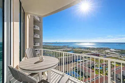 High-rise balcony with stunning coastal views, sunlit mornings, and resort-style amenities—perfect for relaxing or remote work.