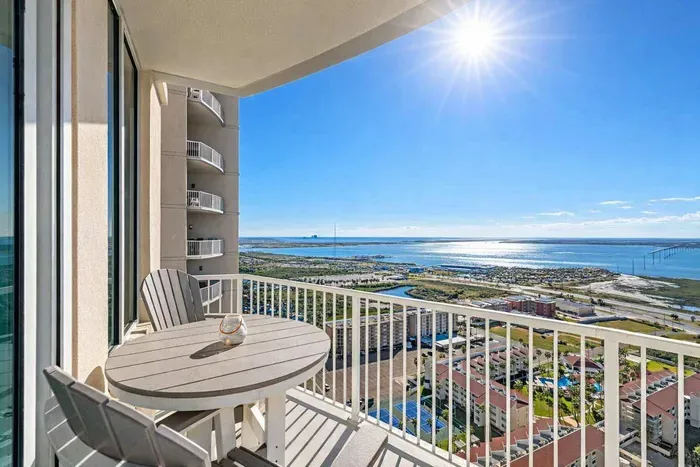 High-rise balcony with stunning coastal views, sunlit mornings, and resort-style amenities—perfect for relaxing or remote work.