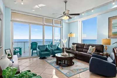 Oceanfront Living Room with Balcony, Teal Accents & Coastal Decor – Steps to the Beach, Bright Natural Light, and Relaxing Views