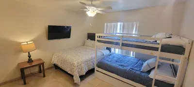 Calming bedroom retreat with a cozy bed, soft blue accents, and simple décor that creates a peaceful, restful atmosphere.