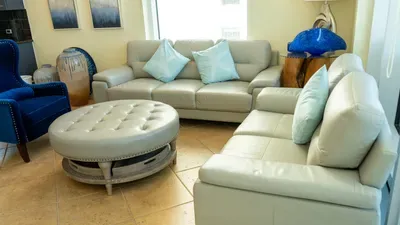 A bright, relaxed living space with soft tones, comfortable seating & a clean layout that feels naturally welcoming. The calm styling and open feel create an easy atmosphere, making it a simple, inviting spot to unwind & enjoy quiet moments together.
