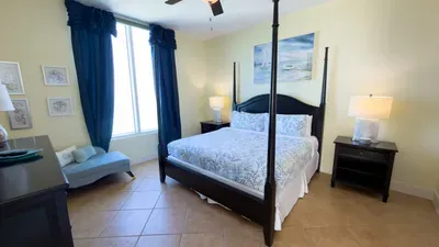 A calm, coastal bedroom with soft colors, simple décor & a relaxed layout that feels naturally welcoming. The clean styling and gentle tones create an easy, unhurried atmosphere, offering a comfortable spot to settle in & unwind throughout the stay.