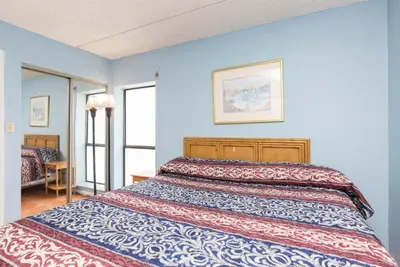 Cozy, Bright Bedroom Retreat
Inviting bedroom with soft natural light, a comfortable bed, mirrored storage, and warm décor—perfect for restful nights and a relaxing stay.