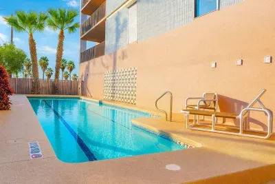 Palm-Framed Poolside Retreat with Sun Deck
Unwind by the sparkling pool in this serene tropical escape. Lounge under palm trees, soak up the sun, and enjoy a peaceful setting just steps from your suite.