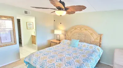 king bed in master with en suite bathroom and walk in shower