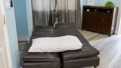 A simple, flexible space with a calm, easy vibe, offering a relaxed spot to unwind or settle in for the night. The soft colors and uncluttered layout create a comfortable, no‑rush atmosphere that feels naturally welcoming.