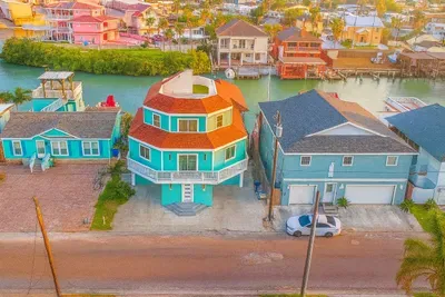 Vibrant Waterfront Retreat | Unique Octagon Home | Canal Views & Walk to Beach