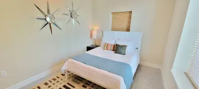 A calm, thoughtfully arranged room where soft light, clean lines, and gentle tones create an easy sense of comfort. The balanced décor and relaxed layout make it a welcoming place to unwind, offering a simple, restful atmosphere throughout your stay.