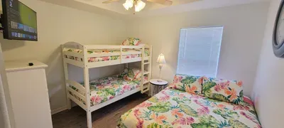 Bright & Cozy Family Bedroom w/ Bunk + Comfy Bed — Tropical Bedding & Plenty of Space for Everyone