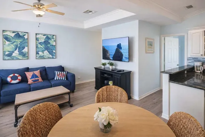 Coastal Retreat w/ Bright Interiors, Navy Sofa, Tropical Art, Full Kitchen & Dining Nook – Steps to Beach!