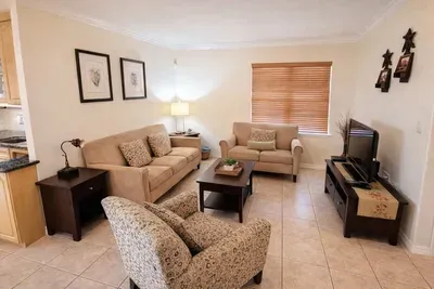 Cozy Living Room Retreat – Bright, Clean, and Inviting with Stylish Seating, Smart TV, and Natural Light