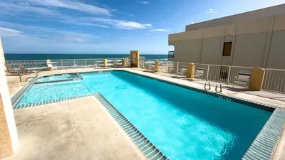 Infinity-Edge Oceanview Pool Paradise
Dive into luxury at this resort-style pool with sparkling lap lanes, bubbling spa, and chaise loungers under sunny skies. Overlook endless Gulf waves crashing ashore—pure bliss! Gated deck ensures privacy.