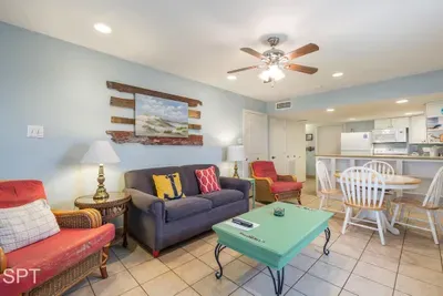 A bright, welcoming space where coastal colors and easygoing décor create a relaxed, lived‑in feel. The open layout brings a sense of warmth and simplicity, making it a comfortable spot to unwind, gather, and enjoy unhurried moments together.