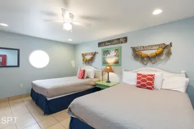 A bright, nautical‑inspired room with easygoing charm, where soft colors and playful coastal details create a relaxed, welcoming feel. It’s a simple, cheerful space that brings a sense of ease and lightness to every stay.