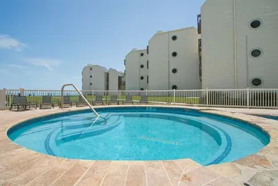 Beachfront Condo with Pool & Ocean Views
Relax in this beachfront condo featuring a circular pool, ocean views and modern amenities. Steps from the sand, with lounge seating and resort-style vibes — perfect for your coastal getaway.