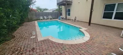 Sunny Pool • Sparkling Water, Relaxing Loungers & Quiet Enclosed Patio • A Perfect Spot to Unwind and Enjoy Warm Island Days