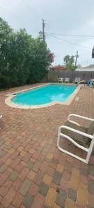 Outdoor Pool • Spacious Patio, Lounge Seating & Relaxing Backyard Setting • A Perfect Spot for Sun, Swim & Unwinding