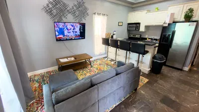 A bright, easygoing living space where soft light, simple décor, and an open layout create a naturally welcoming flow. A comfortable spot to unwind, share moments, and settle into a stay that feels calm, connected, and effortlessly livable.