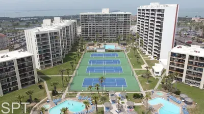 Calm resort-style setting with wide open spaces, bright courts, and a relaxed coastal backdrop that feels naturally inviting. A genuine, easygoing environment that sets the tone for an unhurried stay.